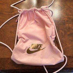 Nike pink drawstring bag with side zipper